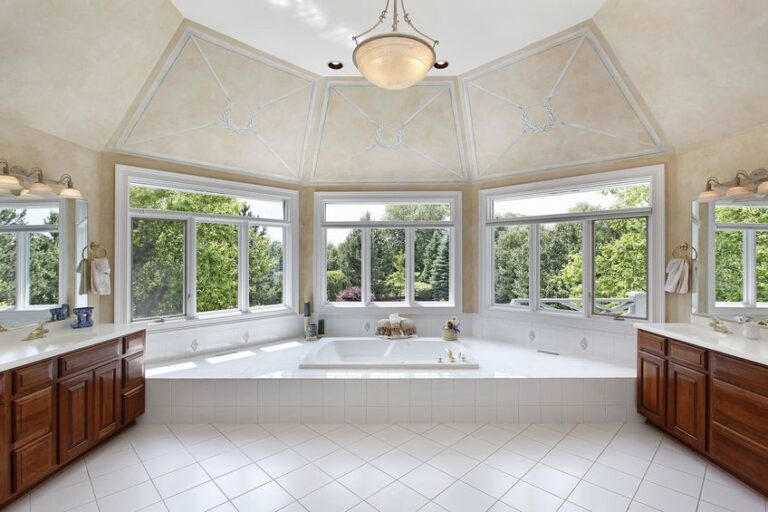 master bath in luxury home with windowed tub area