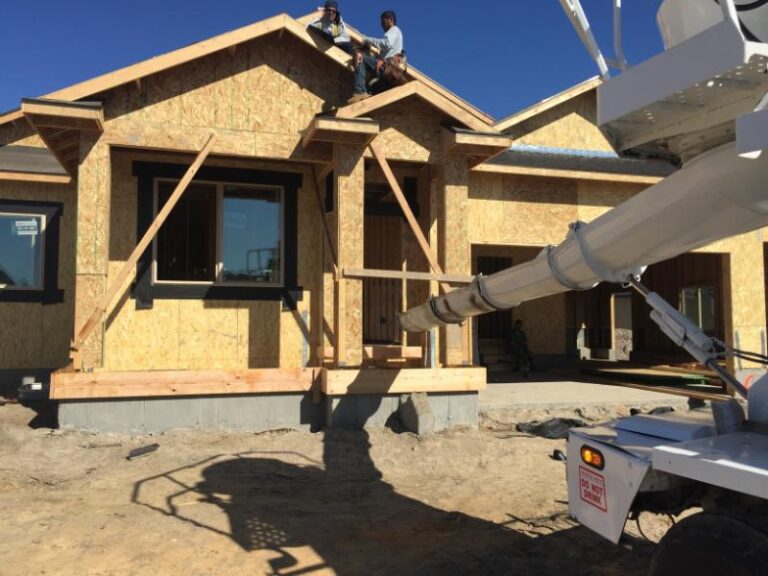 Smith Builders Work team installing roof framing during home renovation