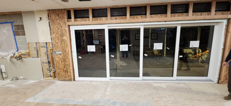 Sliding glass doors installed in exterior renovation project